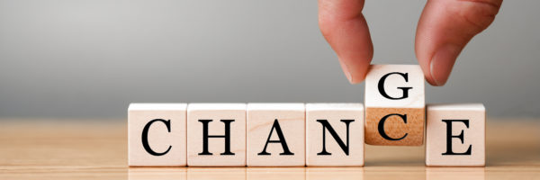 Hand flip wooden cube with word 